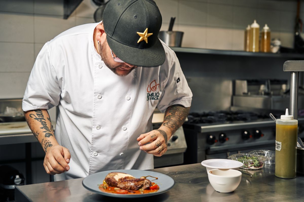 Chef preparing a refined private dining experience